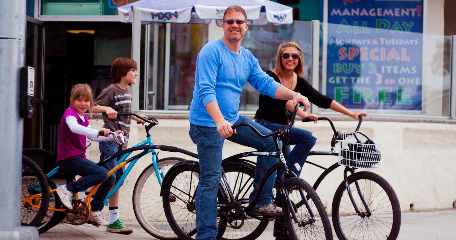 a person riding on the back of a bicycle
