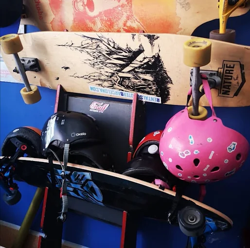 Longboards and helmets displayed inside the RSB shop in Vila Olímpica, Barcelona